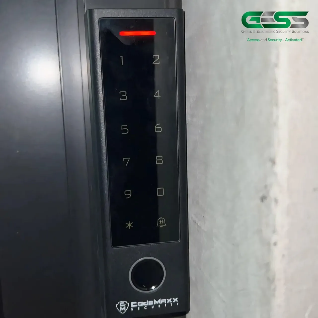 Slim keypad with a fingerprint reader mounted beside a door