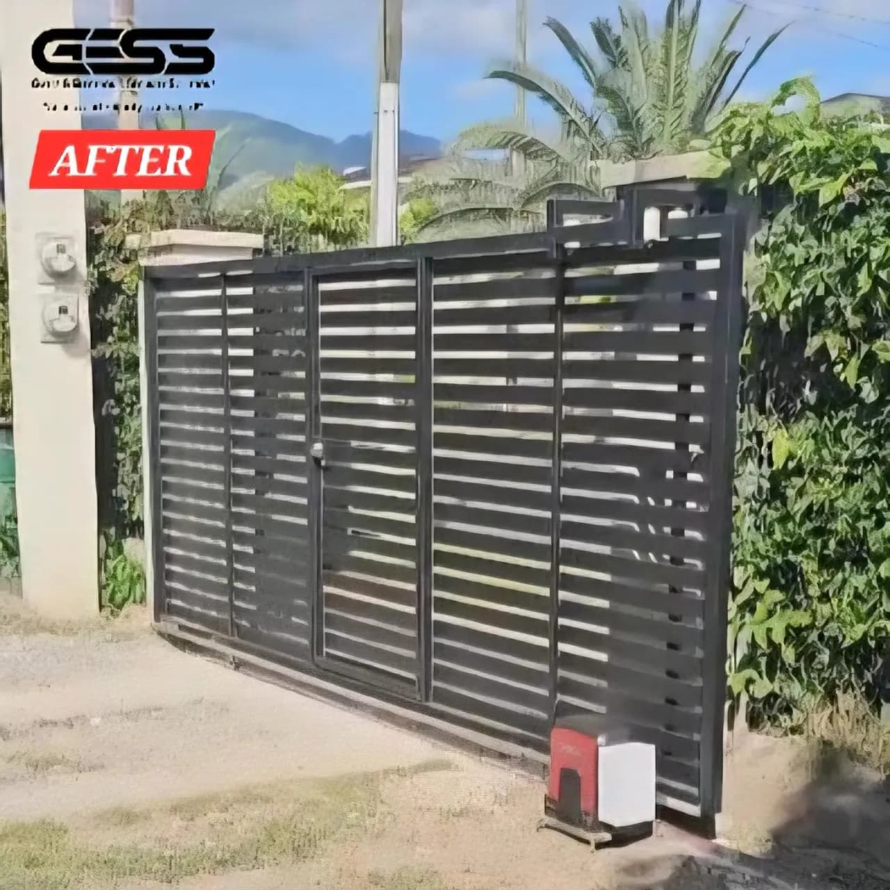 Finished black louvred sliding gate with its operator at the base